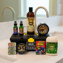 Load image into Gallery viewer, Collection of Gahlay products including bottles, containers, and a soap on a bathroom counter.
